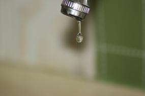 falling drop of water from the faucet
