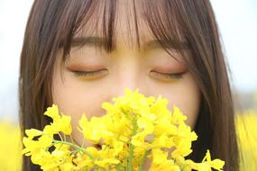 Asian girl with yellow flowers