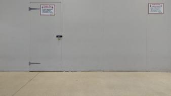 the doors are gray with a sign