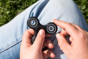 black spinner in hand