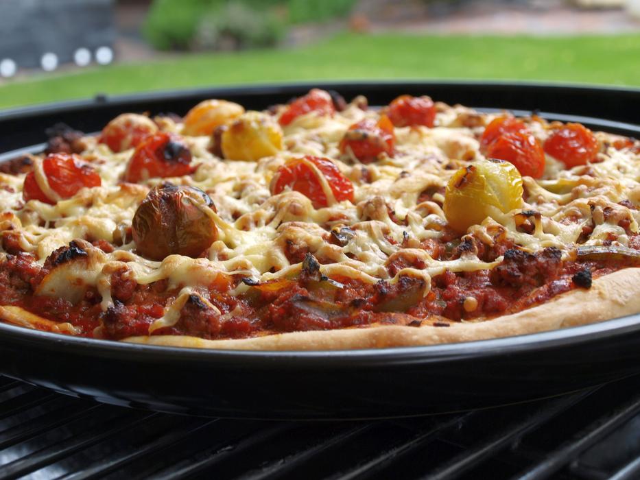 hot pizza with vegetables and cheese