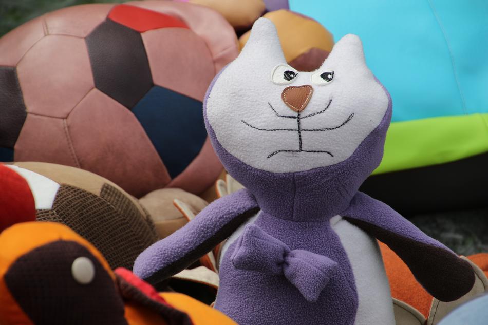 The cat is a soft toy