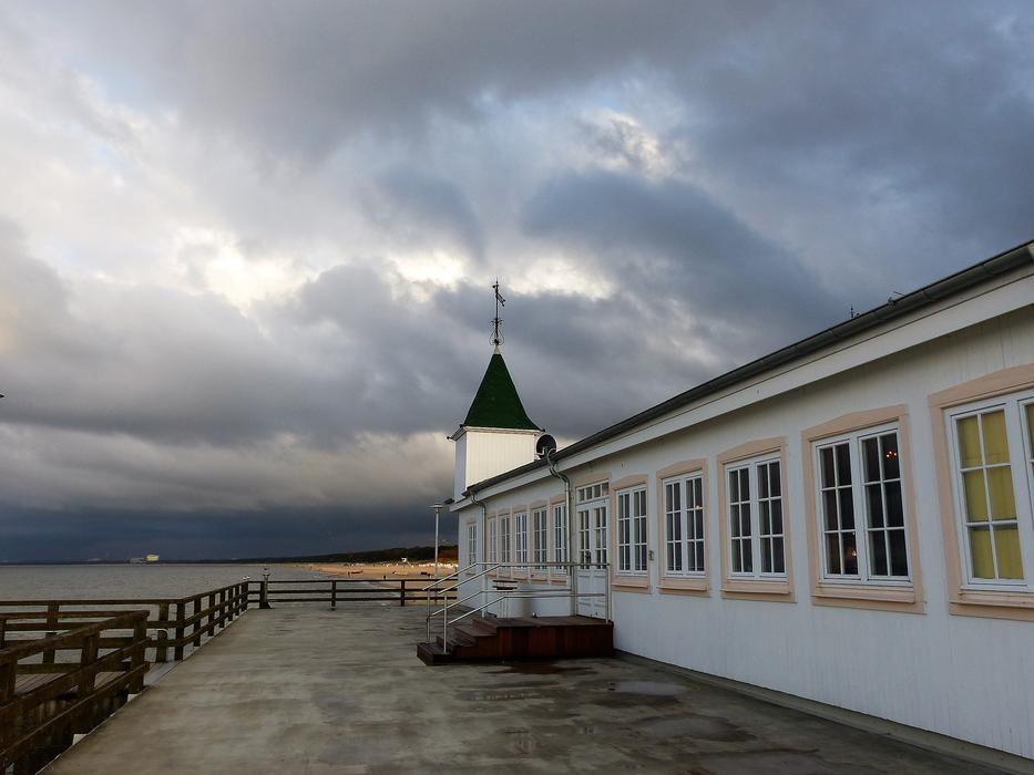 cozy house under gray clouds