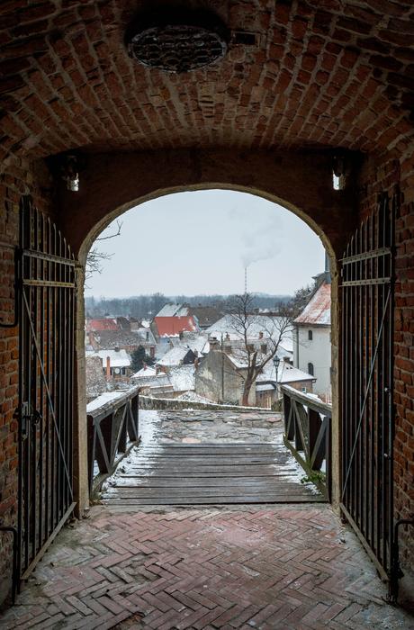 the arch is large with a view of the bridge