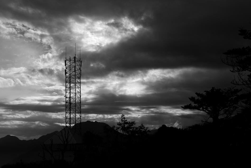 old iron tower on a black background
