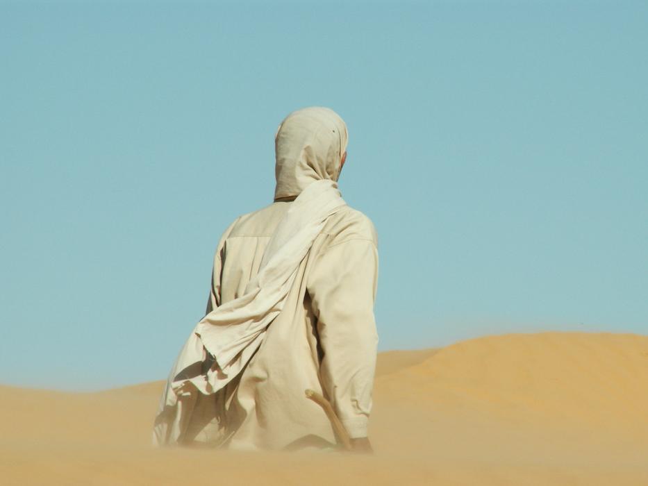 nomad walking in the desert