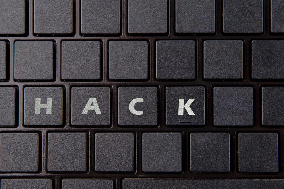 'Hack' sign on the keys of the black keyboard