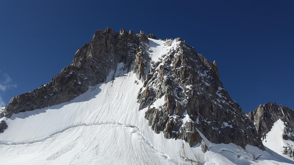 a high mountain in white snow