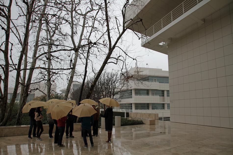 People with umbrellas near Getty Centre in Los Angeles, USA