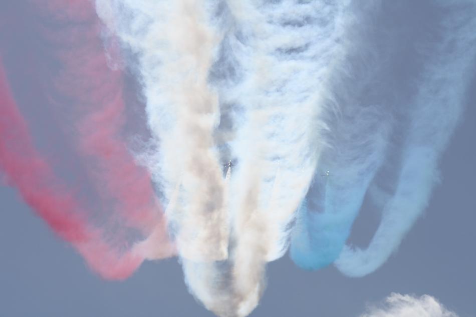 colored smoke from an airplane show