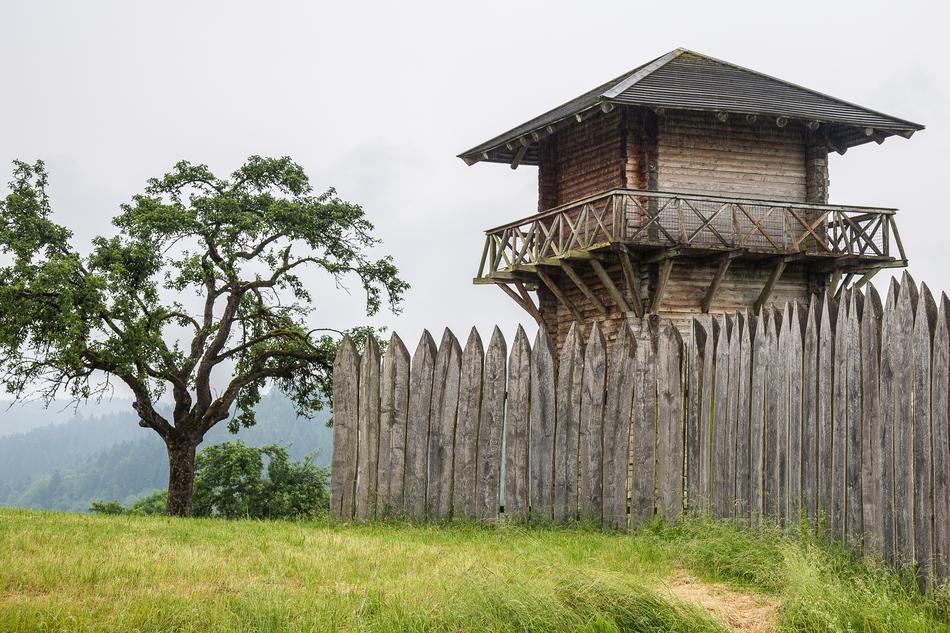 a beautiful building with a fence