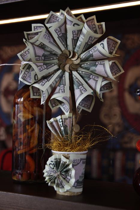 flower in pot, banknotes and coins, decoration