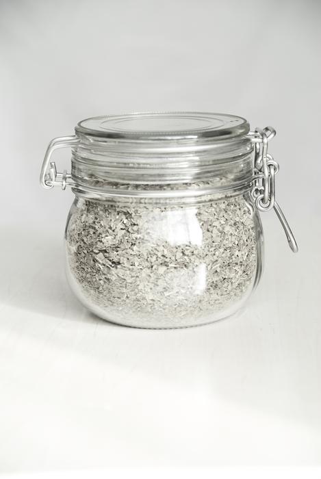 white sand in a glass jar