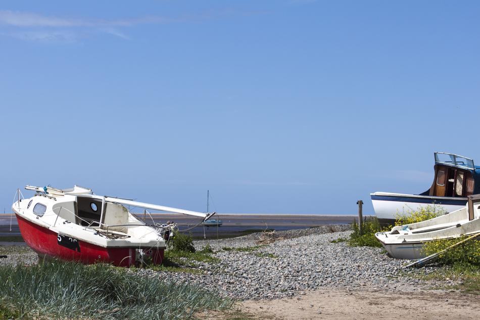 fisherman's boat on the beach by the sea