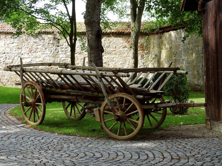 an old cart by the fence