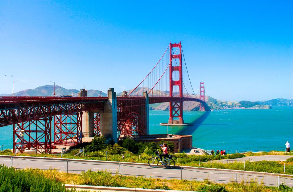 the big red bridge going into the mountains