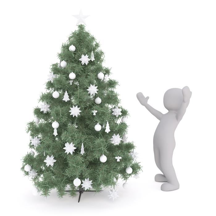 happy man near a fancy christmas tree