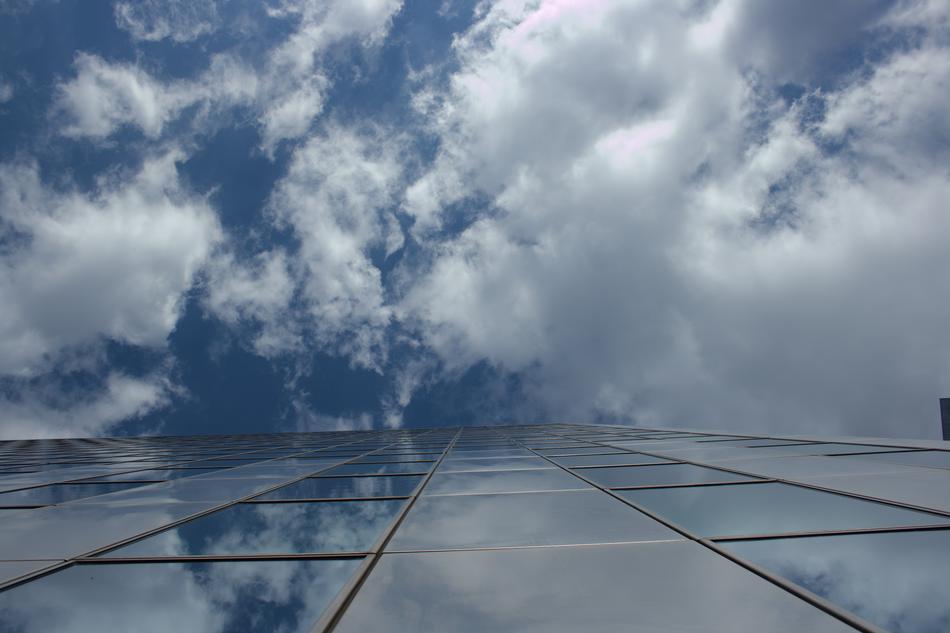 glass house against the clouds