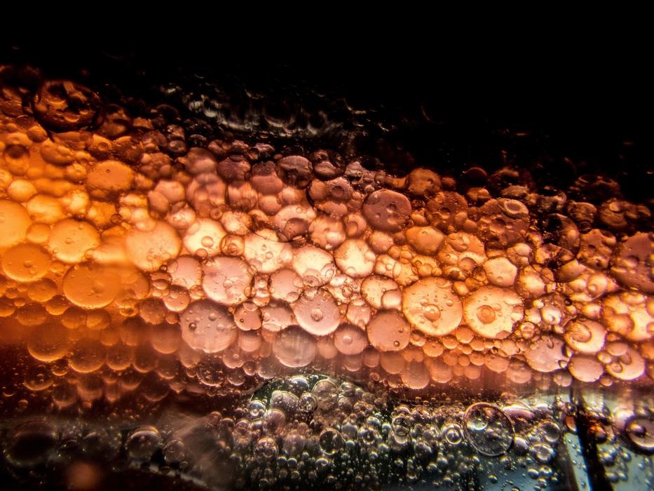 macro shot of droplets on orange background