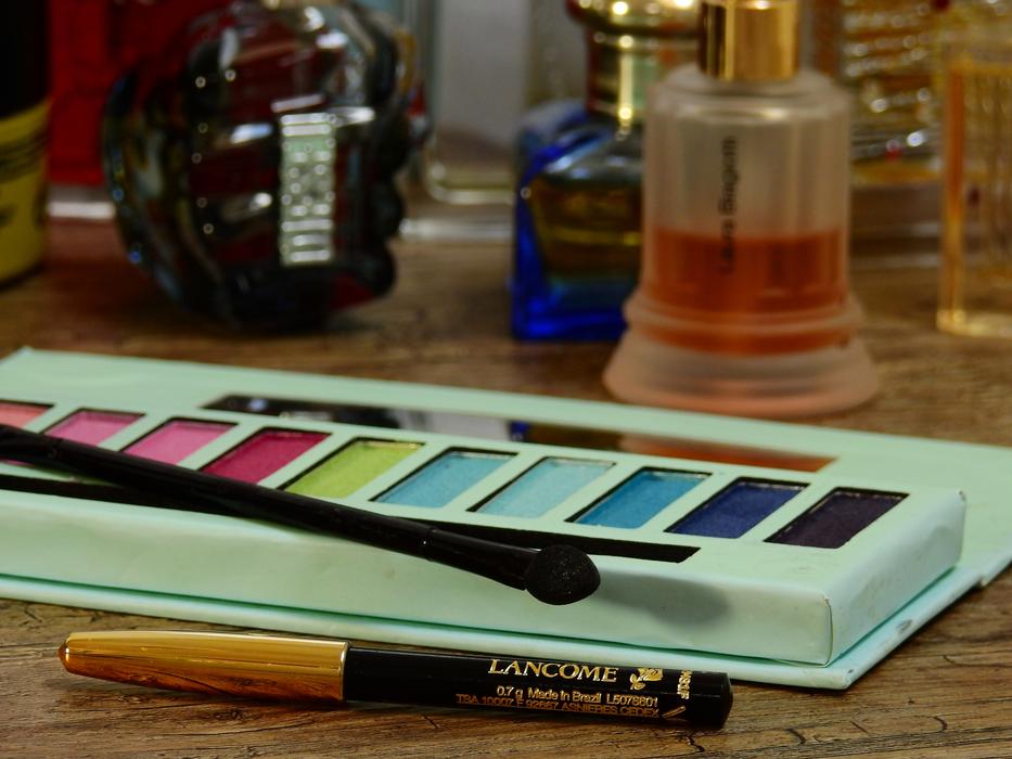 cosmetics with perfume on the table