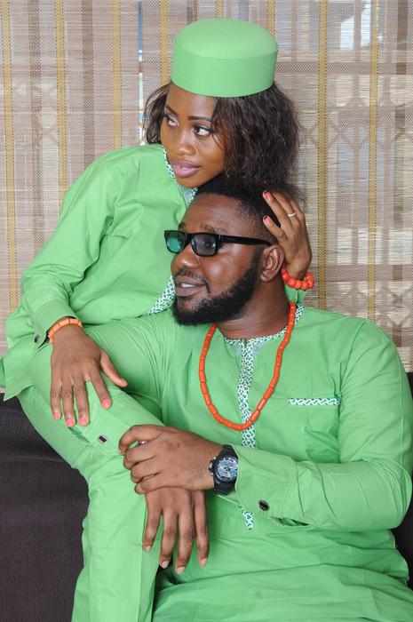 A happy couple in a green suit