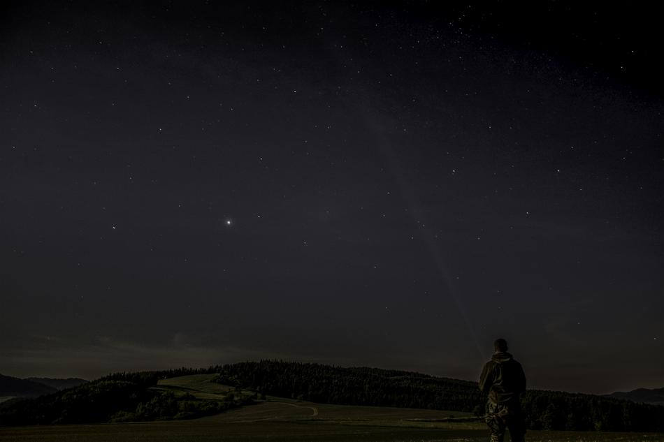 man in the night sky with stars