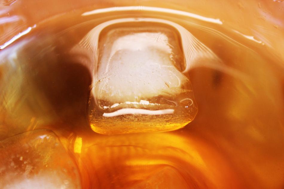ice cube in a glass of juice