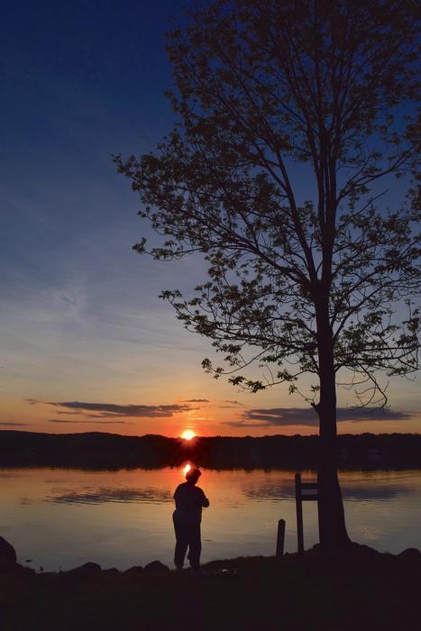 Fisherman Silhouette on Shore