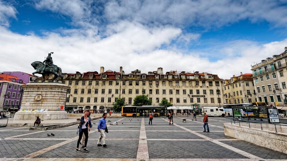 people walking in a beautiful square
