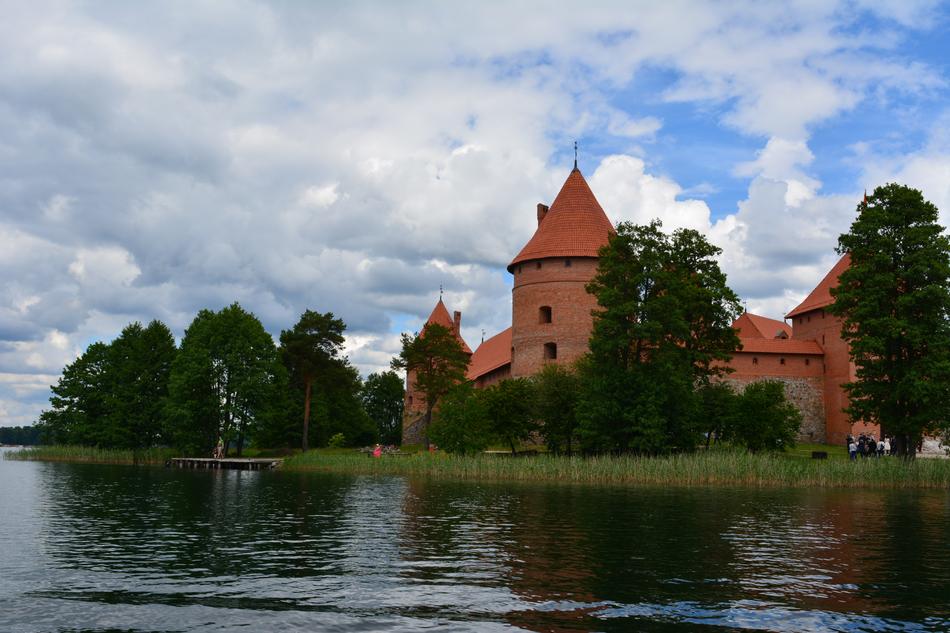 The red castle behind the trees