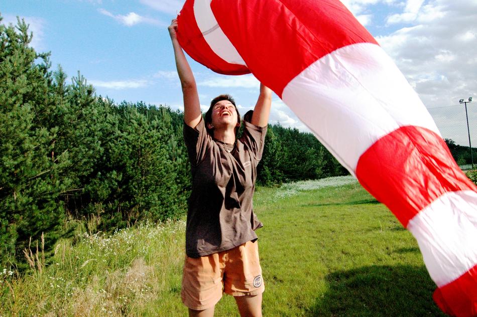 photo of a guy with a red striped windsock