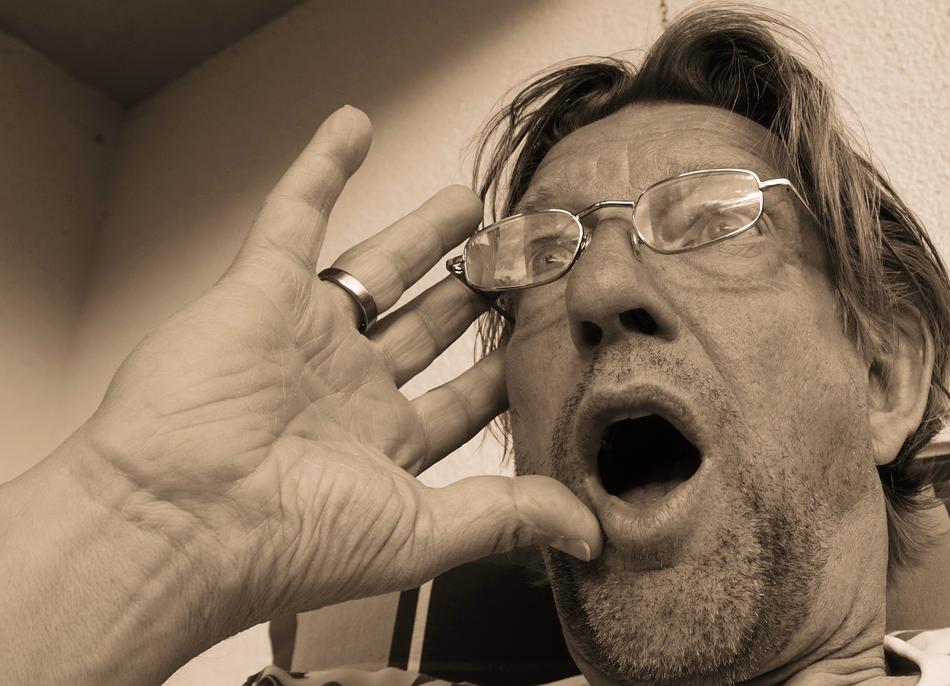 a surprised man with glasses