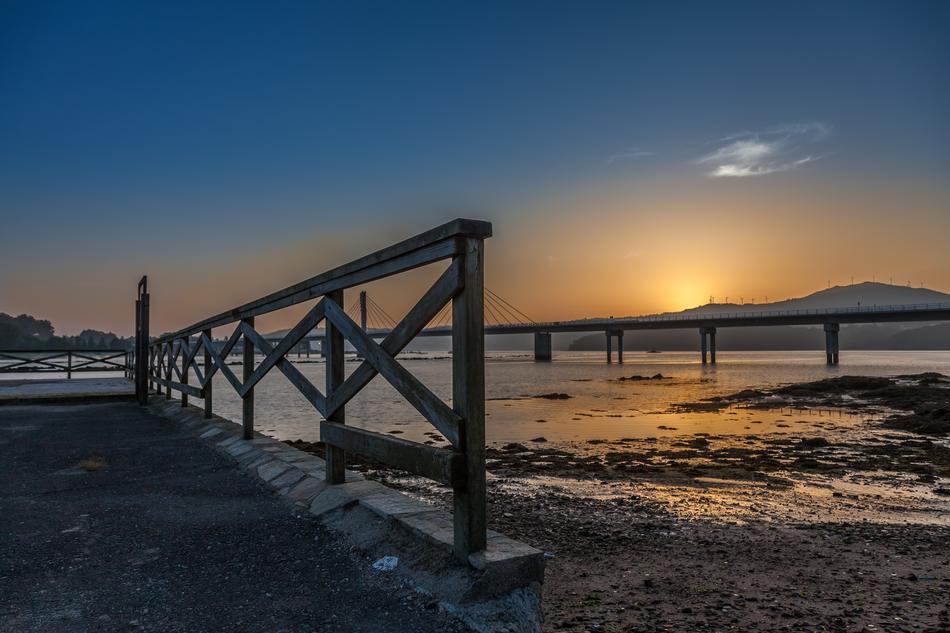wooden fence on the beach by the sea