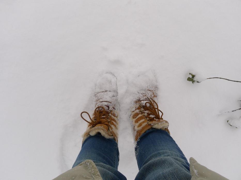 feet in the cold snow