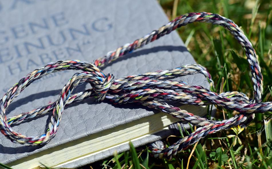 colored rope on a book