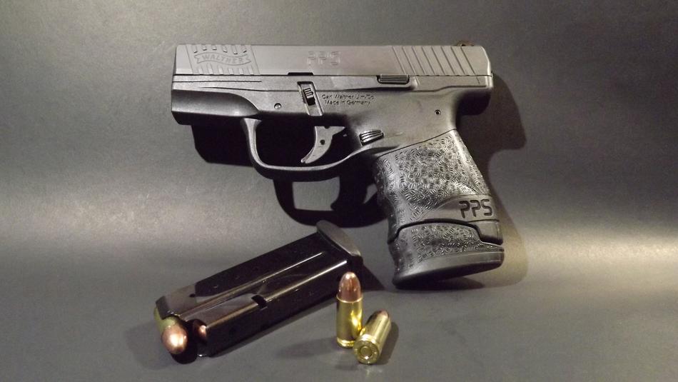 gun with ammo on the table