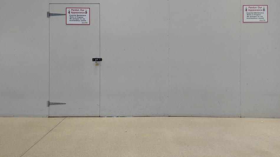 the doors are gray with a sign