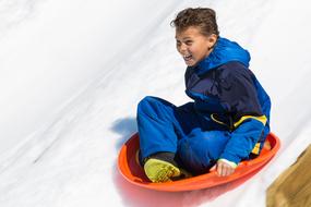 happy child going down an ice slide