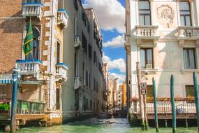 Beautiful canal with gondolas among the buildings in Italy