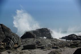 Strong waves crashing against the rocks
