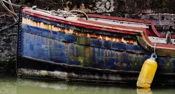 an old boat on green grass