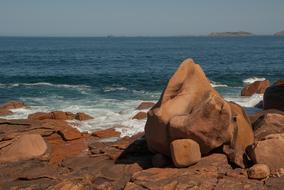 large rocks on the beach by the sea