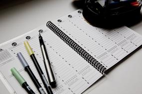 beautiful pens on a notebook look