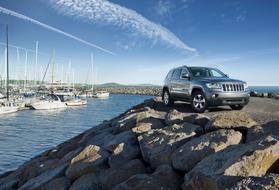 a car on the rocks under a blue sky