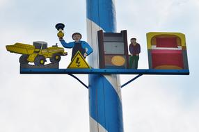 funny figures on a pole