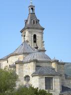 the old church is white with a gray roof.