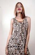 Sexy young girl with big lips wearing dress with animal print