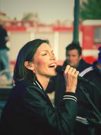 attractive young woman singing
