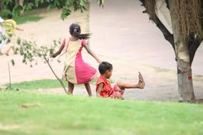 poor children play outdoors