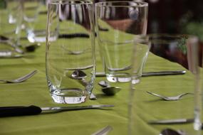 glass tumblers on the green table